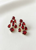 Red Czech glass leaf earrings on white