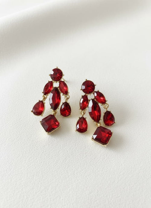 Red Czech glass leaf earrings on white