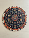 Round floral rug mat with navy and orange medallion
