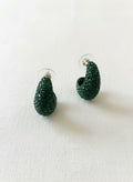 Green Czech glass drop earrings on white