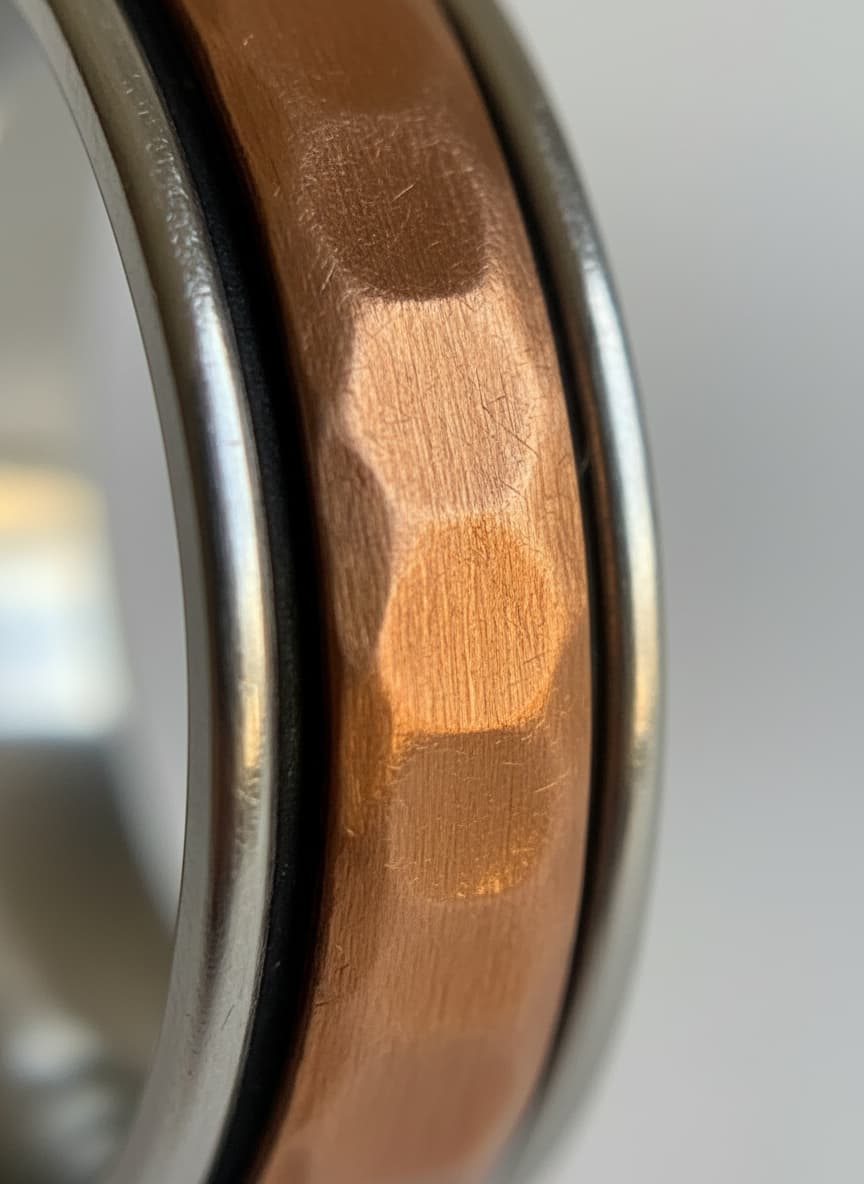 Macro close-up of the hammered copper band