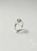 Silver bypass ring with pink Czech glass on white