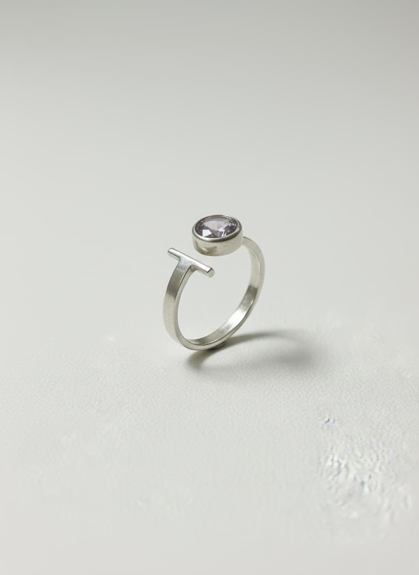 Silver bypass ring with pink Czech glass on white