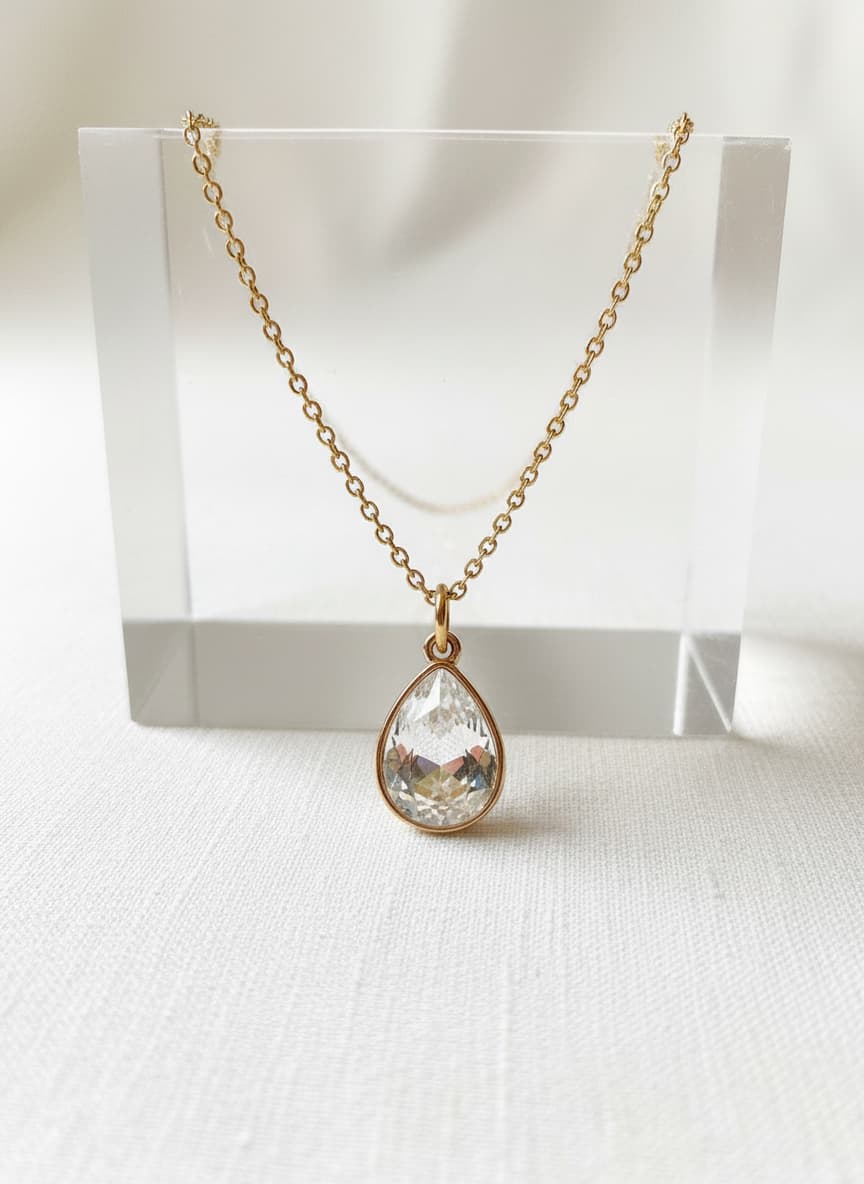 Gold teardrop necklace with clear crystal pendant