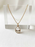 Gold teardrop necklace with clear crystal pendant