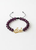 Gold eshgh bracelet with purple stones on white
