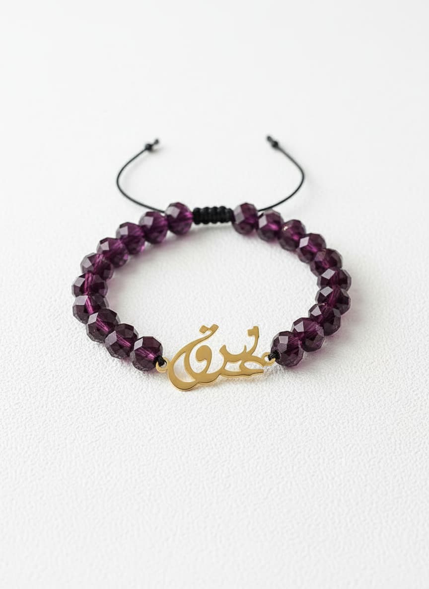 Gold eshgh bracelet with purple stones on white