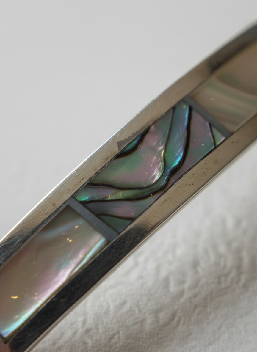 Macro close-up of the floral shell inlay