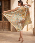 Golden shawl with small blue and white floral pattern
