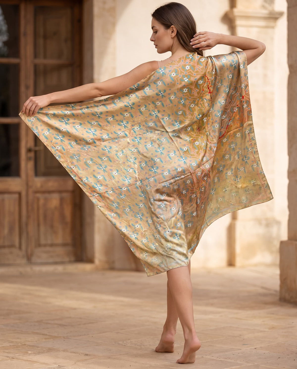 Golden shawl with small blue and white floral pattern