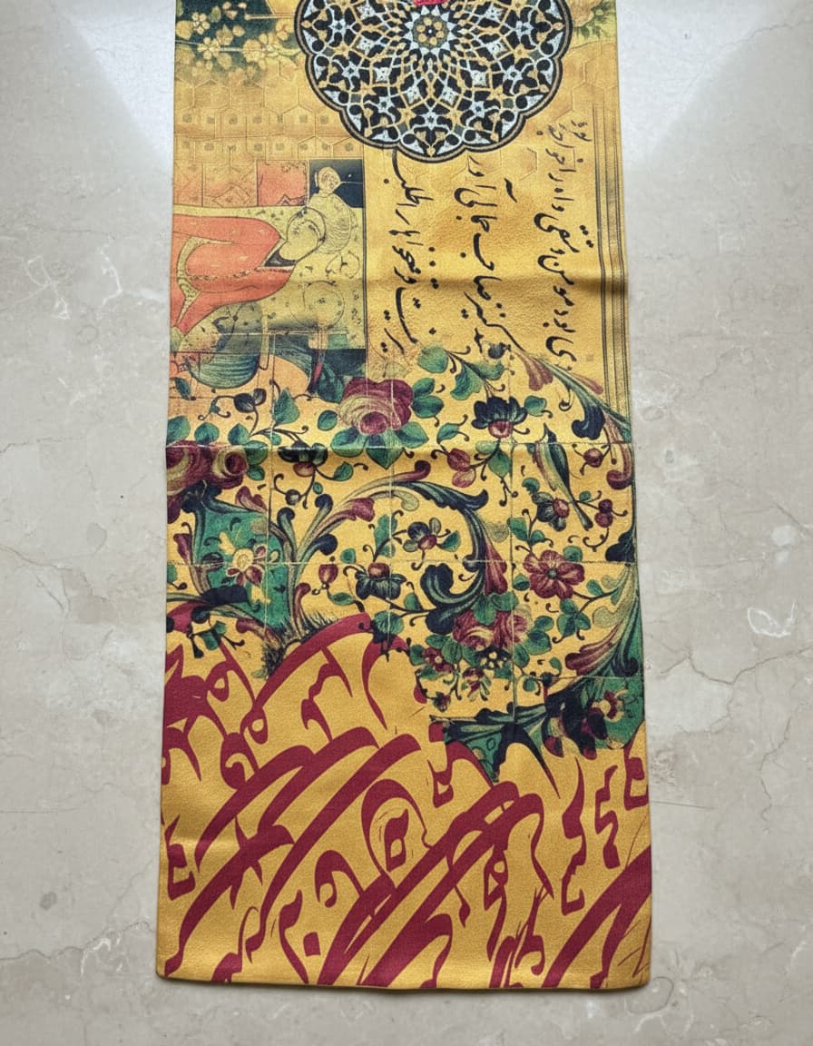 Gold runner detail with miniature drawings