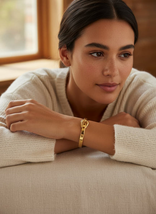 Model wearing the gold-plated belt-buckle bangle
