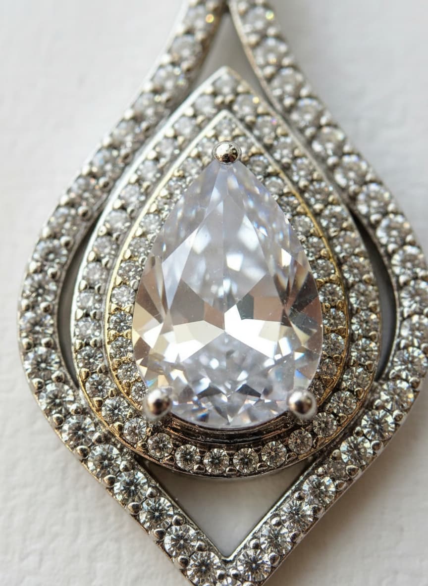 Macro close-up of the teardrop stone and pavé halo
