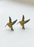 Silver-plated hummingbird stud earrings on white