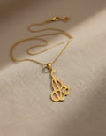 Gold-plated Persian calligraphy flourish pendant necklace on a fine chain