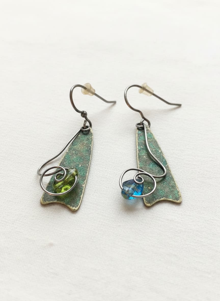 Silver-plated turquoise artistic loop earrings on white