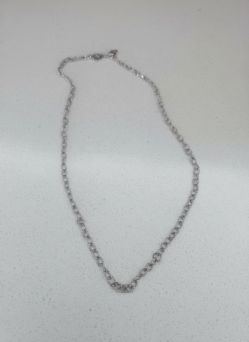 Silver-tone textured link chain necklace on white background