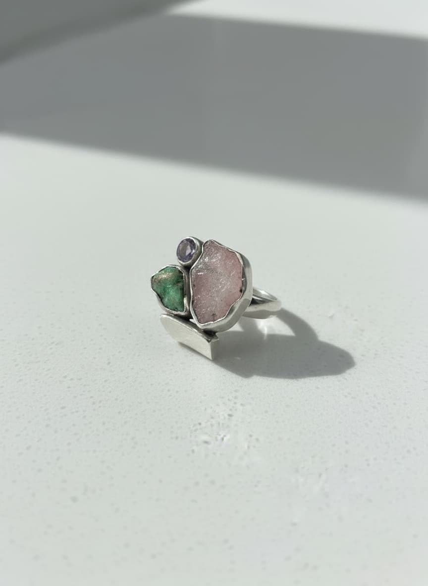 Silver raw crystal trio ring on white background