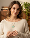 Model wearing the turquoise blue flower pendant necklace
