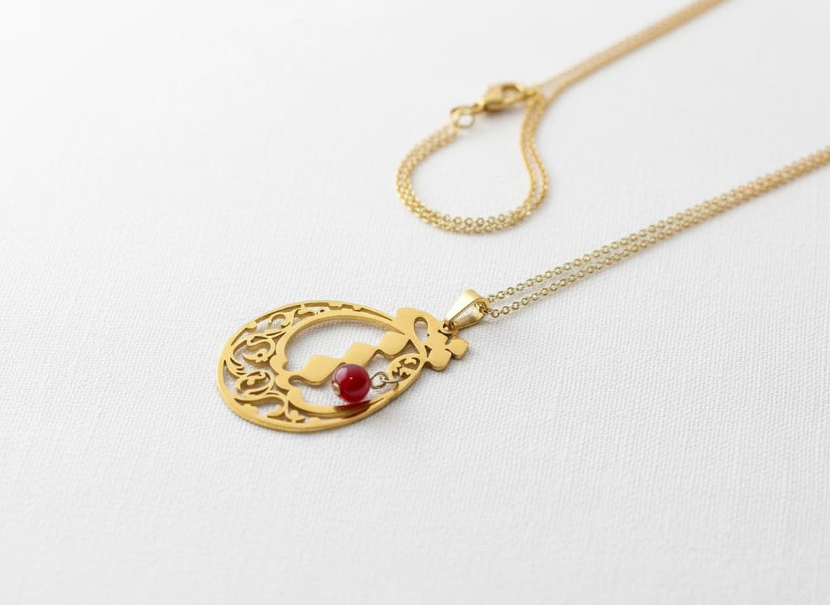 Gold eshgh calligraphy necklace with red stone beads