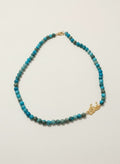 Gold-plated Eshgh calligraphy side necklace with turquoise beads on white