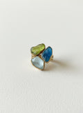 Gold-plated three-stone statement ring on white