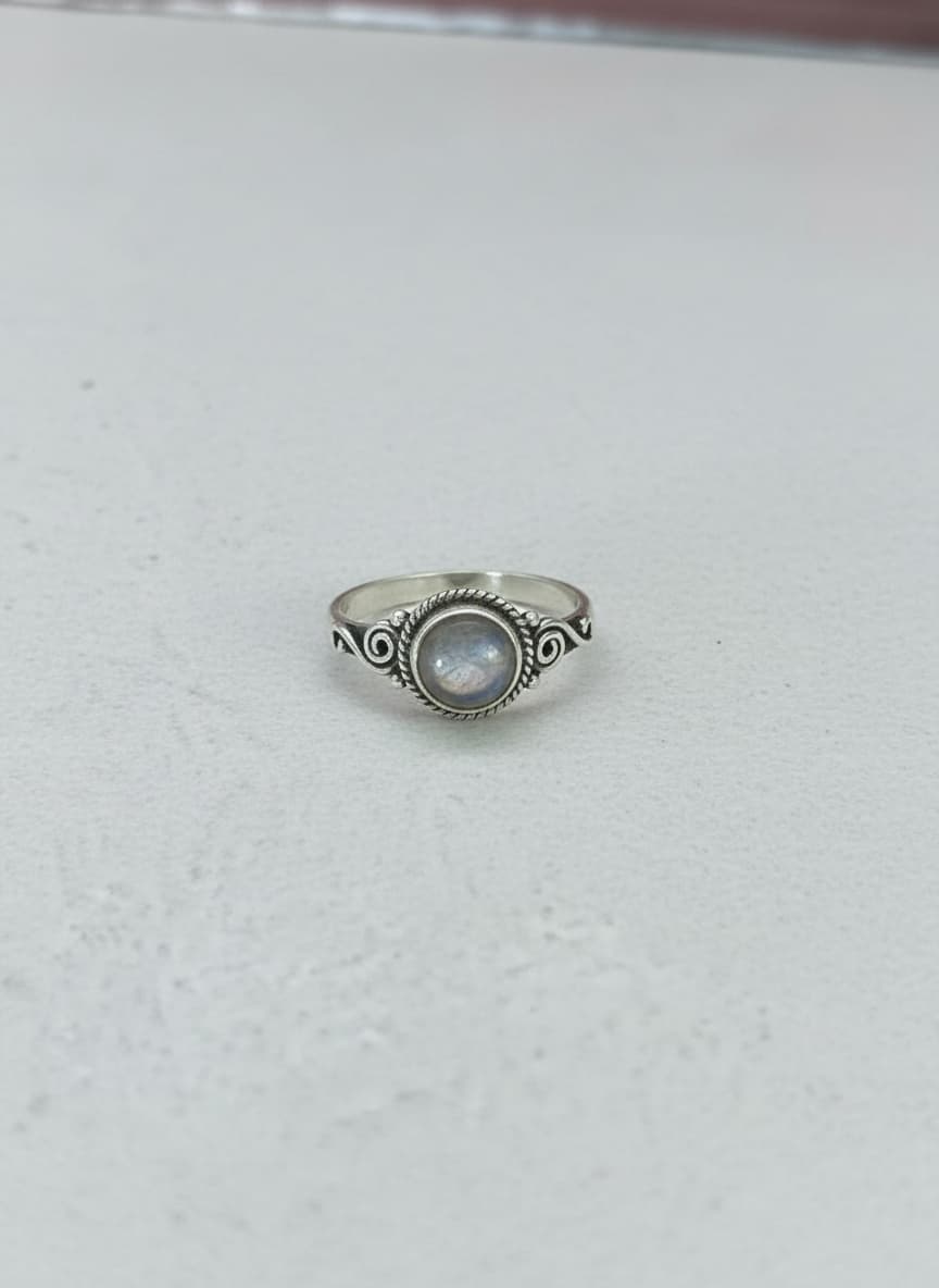 Silver moonstone ring on white background