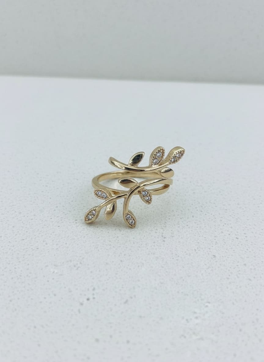 Gold leaf vine ring on white background