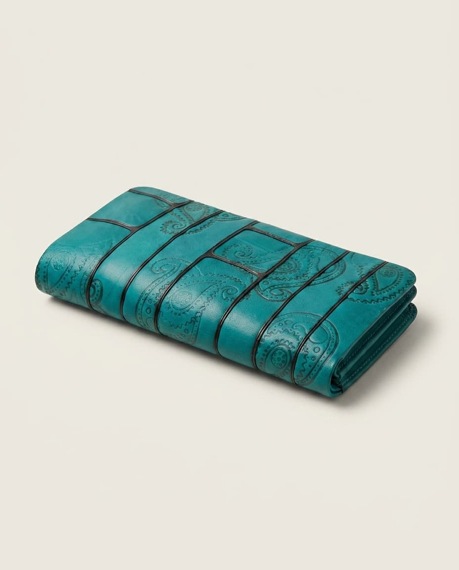 Teal paisley embossed clutch on white