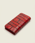 Red paisley embossed clutch on white