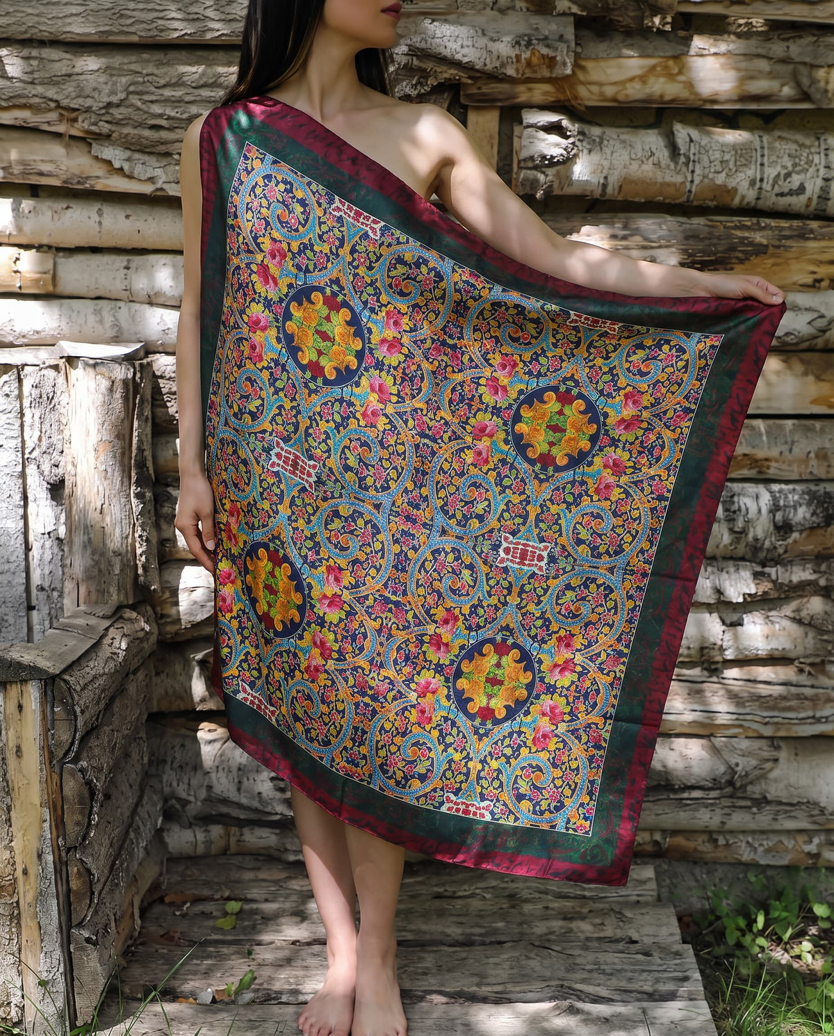 Model wearing a dark navy paisley floral shawl with maroon border