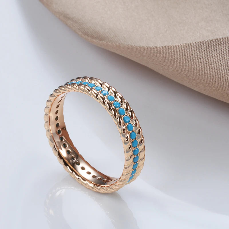 Rose gold eternity ring with turquoise and zircon stones