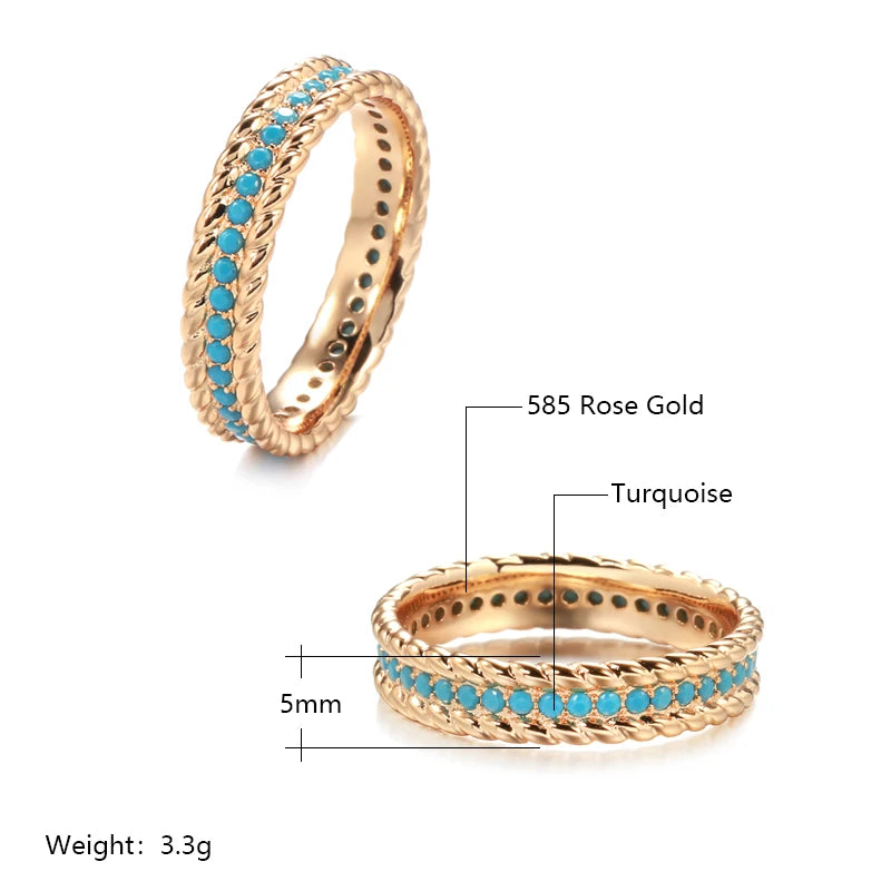 Rose gold ring with turquoise stones on a white background
