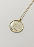 Gold-plated pendant necklace with real pressed dandelion seeds sealed under glass