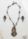 Vintage-style turquoise necklace and teardrop drop earring set in silver tone