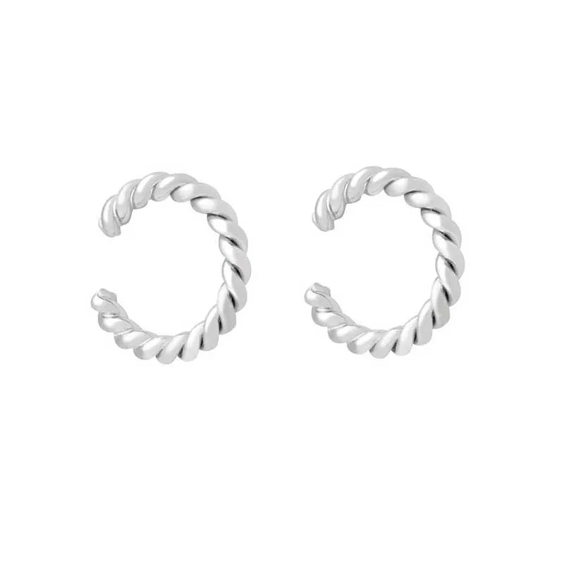 A pair of silver twisted hoop earrings with a textured, rope-like finish, displayed on a clean white background.