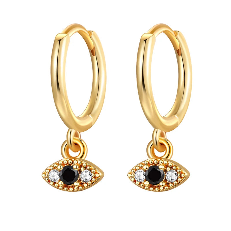 Gold hoop earrings with eye-shaped charms on a white background