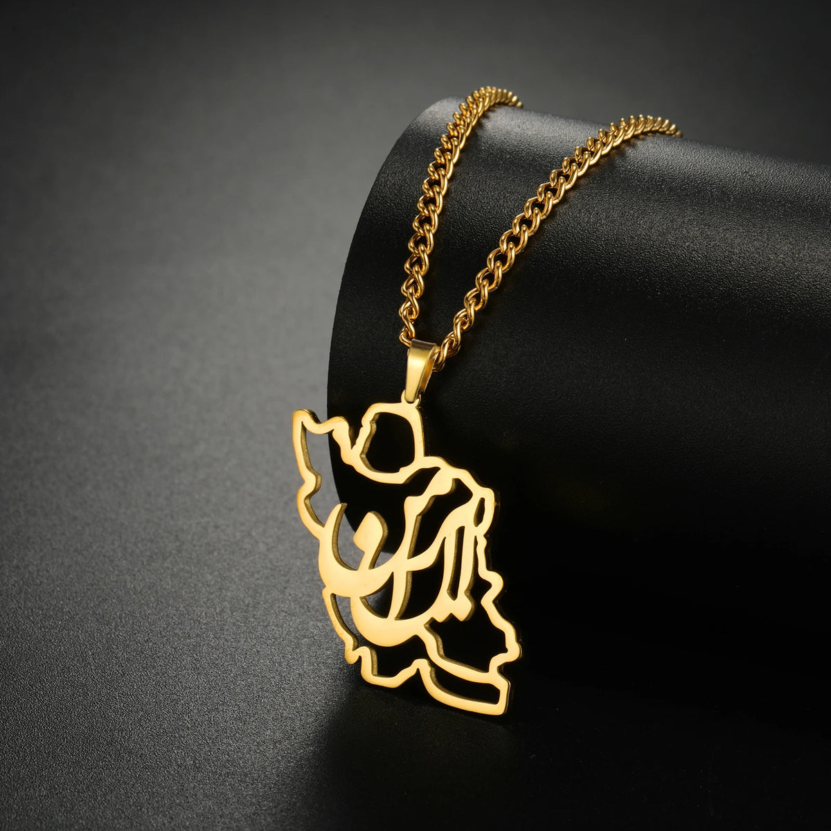 Gold angel pendant necklace on a black background