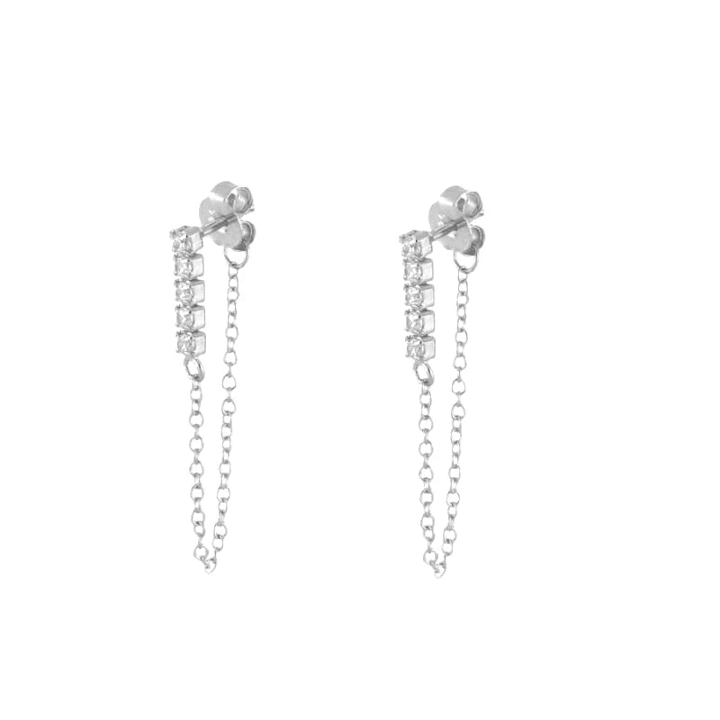 A pair of silver dangle earrings with a short vertical bar of clear stones and a delicate chain hanging from the back, shown on a plain white background.