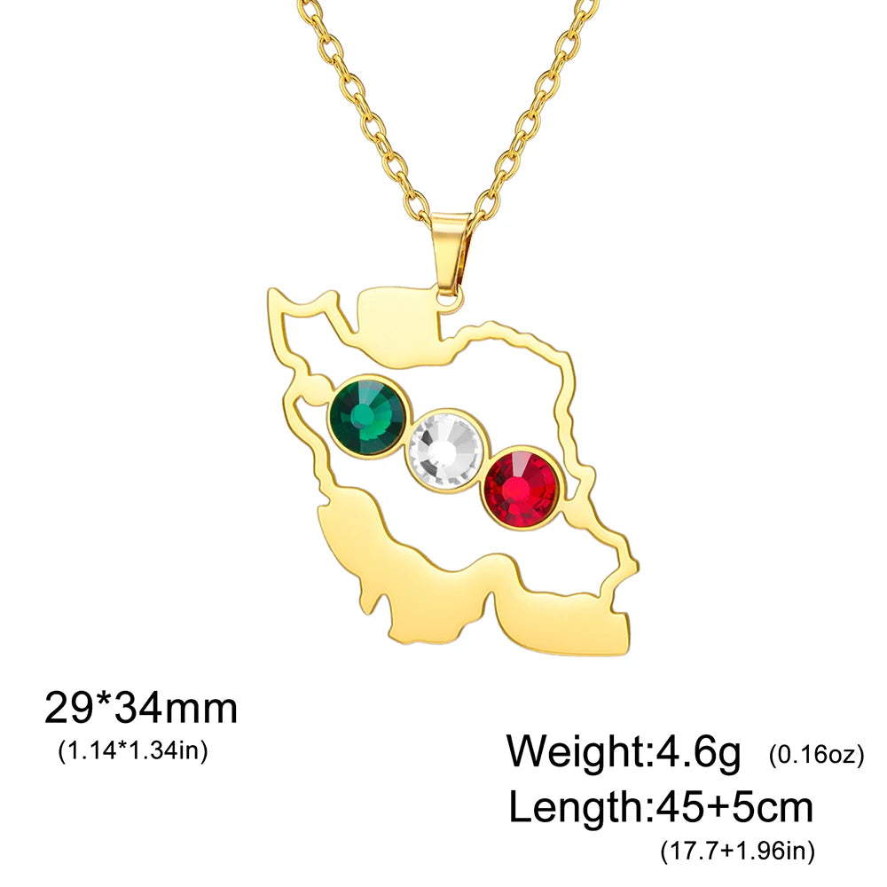 Gold necklace with a map-shaped pendant featuring green, clear, and red gemstones on a white background.