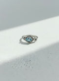 Silver sky-blue pear stone ring on white background