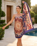 Model holding a navy and burgundy Persian rug floral shawl