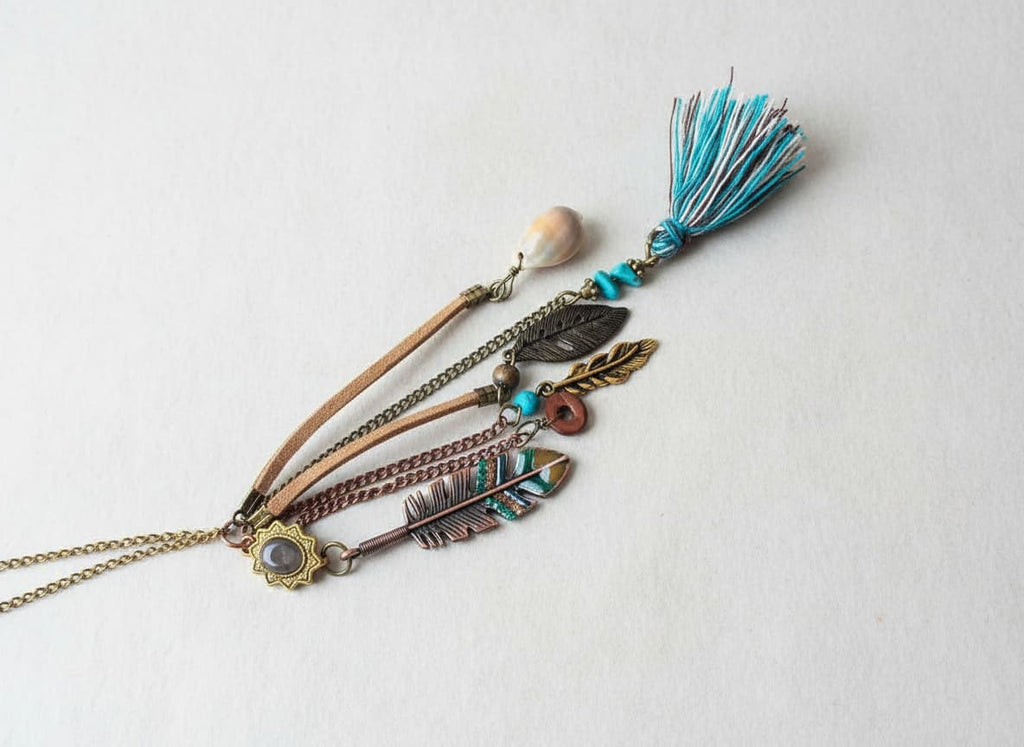 Gold-tone Indian American style tassel necklace on white
