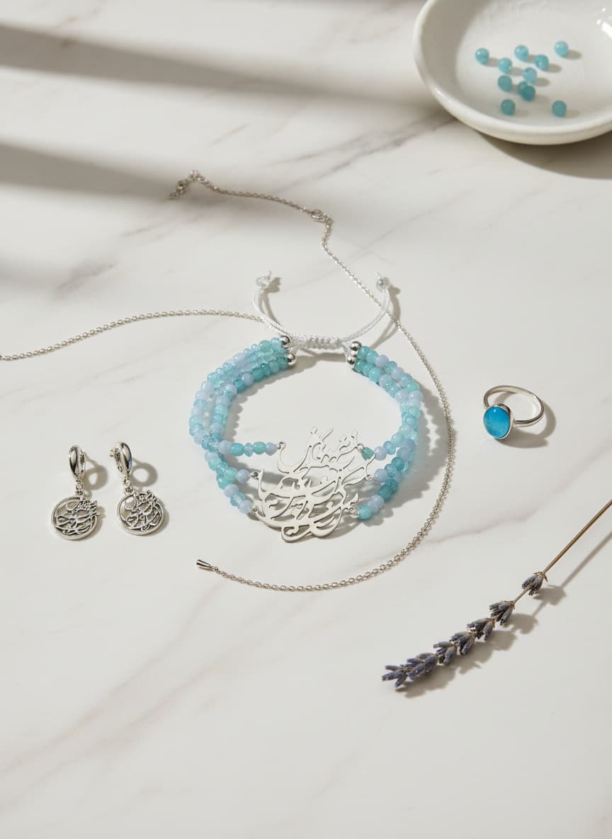 Amethyst bracelet styled in a flatlay with silver jewelry