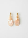 Peach shell disc earrings with gold studs on white
