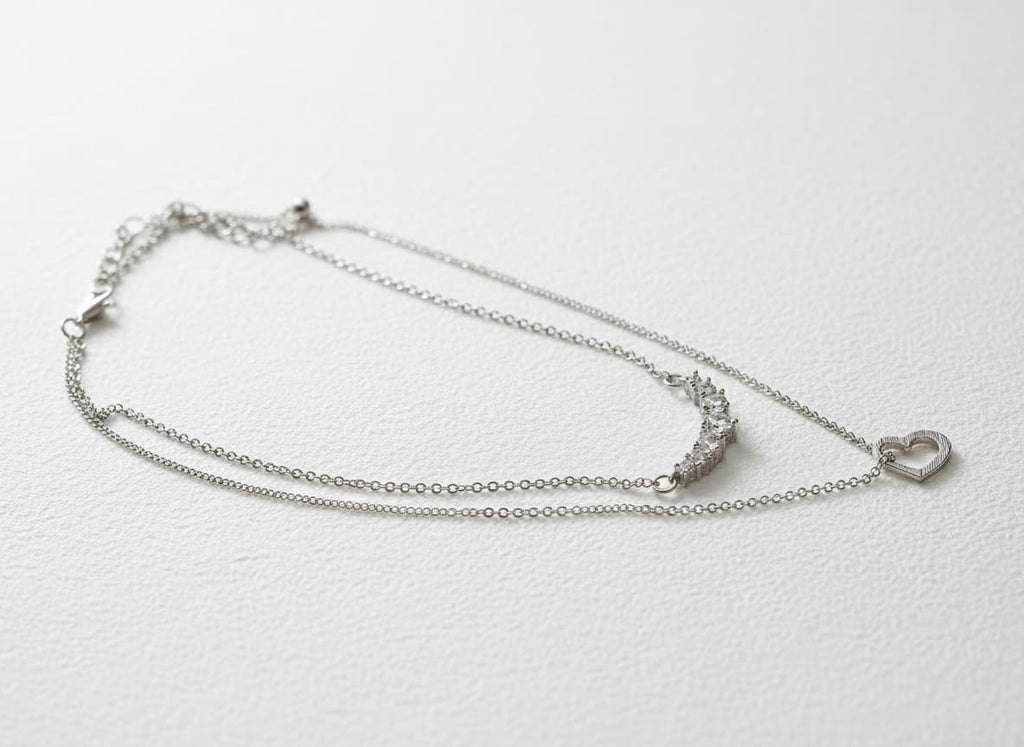 Silver 2-row necklace with crystal bar and heart pendants
