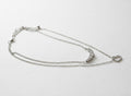 Silver 2-row necklace with crystal bar and heart pendants