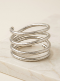 Silver-tone snake chain spiral coil wrap bracelet on marble