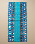 Turquoise velvet runner with geometric tile design