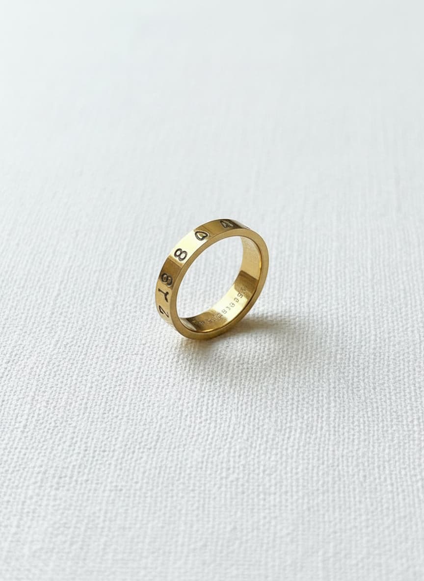 Gold-plated ring with Persian number engraving on white